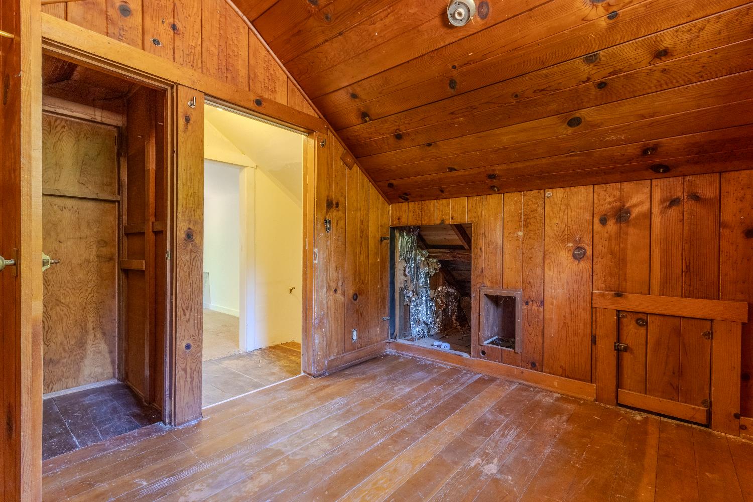 2896 Clay Street Placerville, CA 95667 - Photo 21 of 38 a view of empty room with wooden floor and fireplace