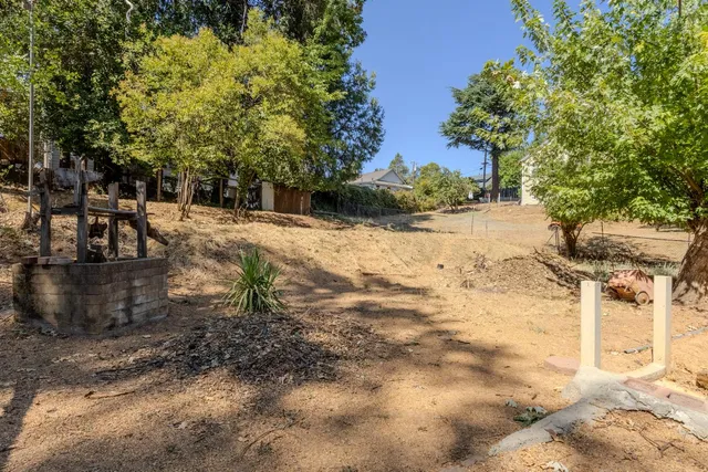 a backyard of a house with lots of green space