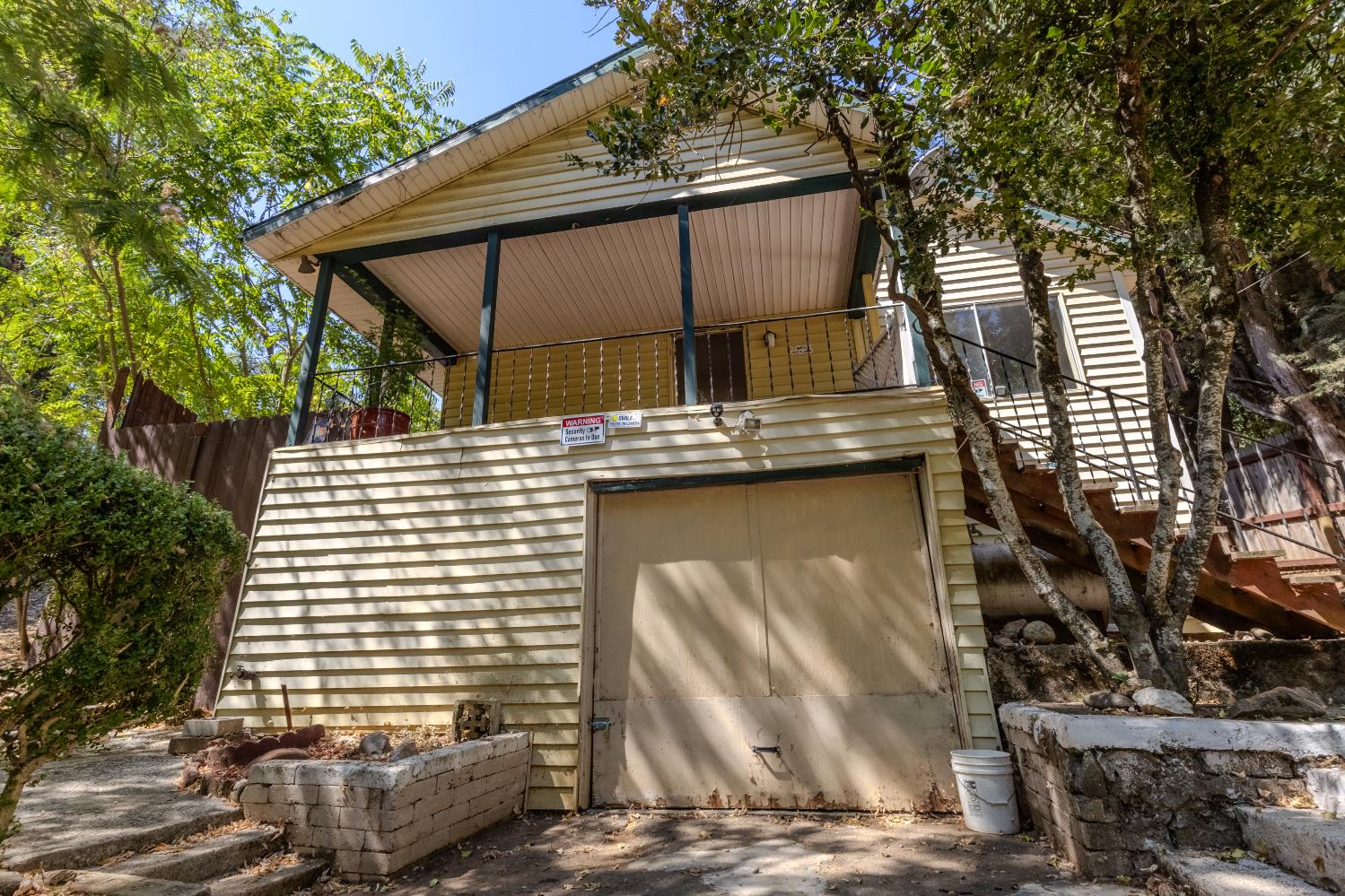 2896 Clay Street Placerville, CA 95667 - Photo 32 of 38 a view of a patio with table and chairs with wooden fence and plants