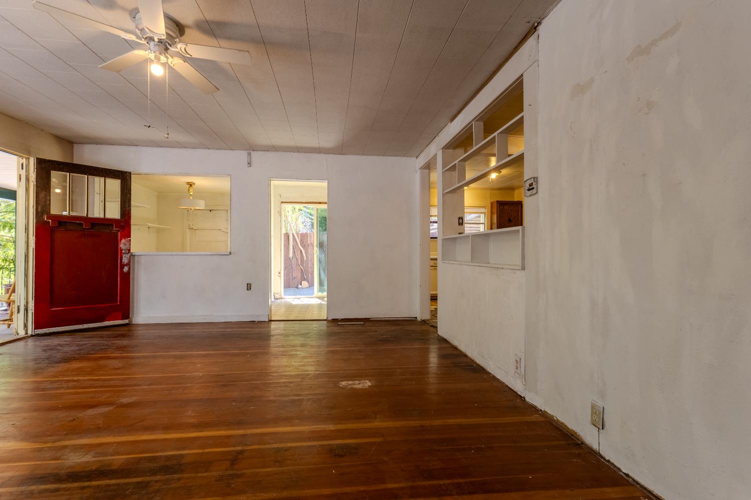 2896 Clay Street Placerville, CA 95667 - Photo 6 of 38 a view of an empty room with window and wooden floor