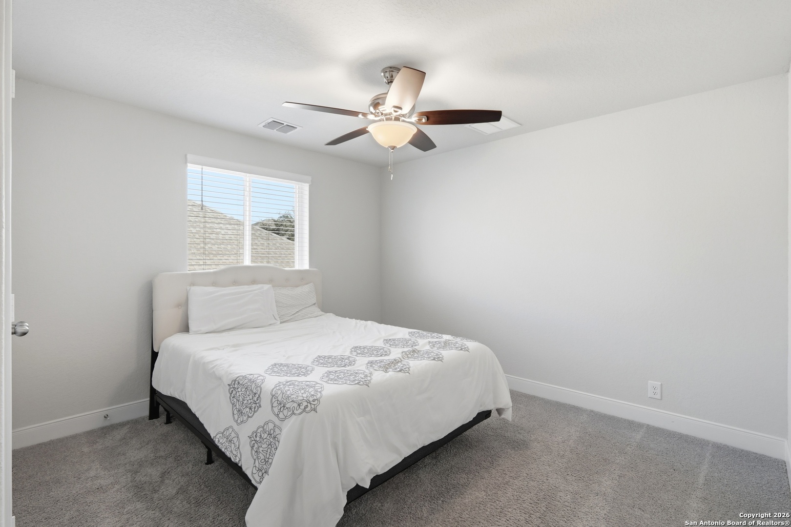 8334 Two Winds San Antonio, TX 78255 - Photo 17 of 39 a bedroom with a bed and window