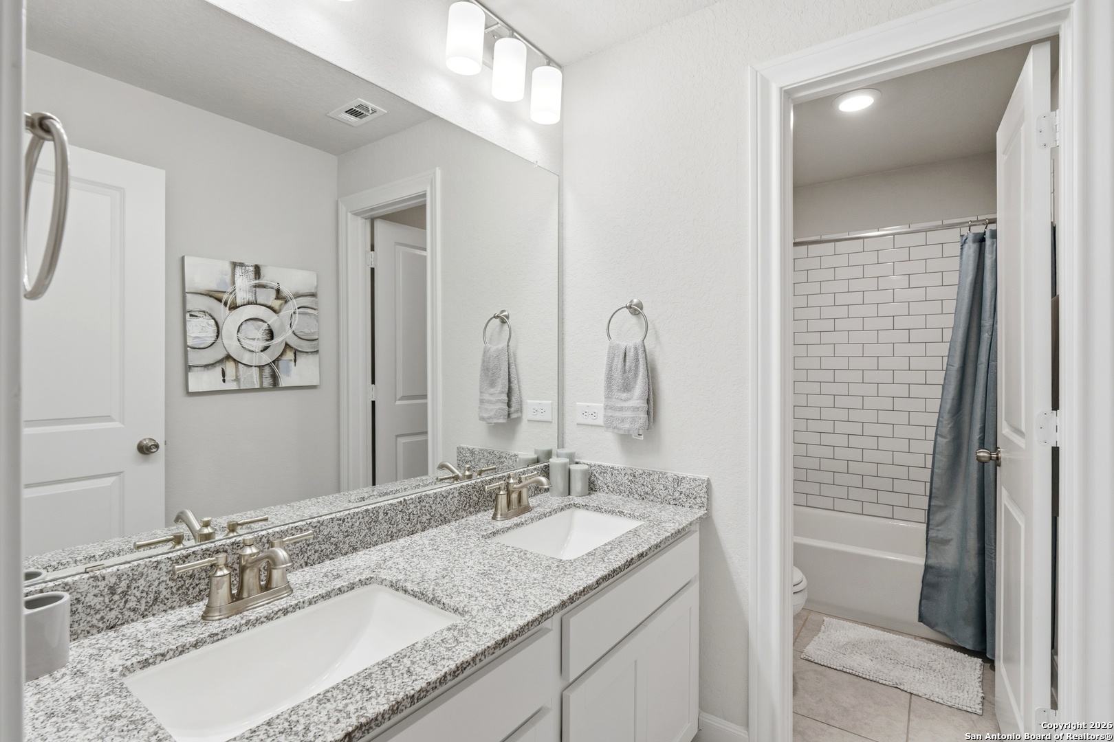 8334 Two Winds San Antonio, TX 78255 - Photo 18 of 39 a bathroom with a granite countertop sink and a mirror