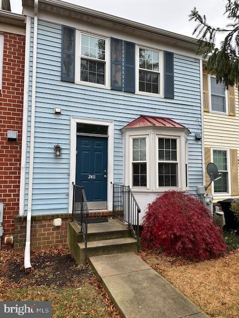 a front view of a house with a porch