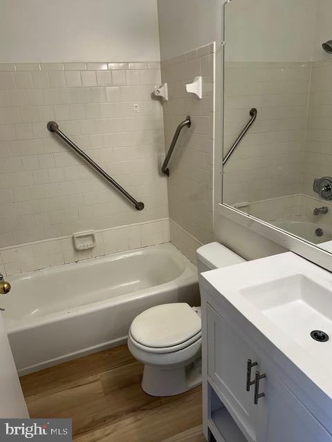 2411 Potterfield Road Windsor Mill, MD 21244 - Photo 16 of 28 a bathroom with a sink a toilet and a bathtub
