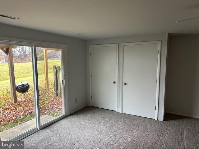 2411 Potterfield Road Windsor Mill, MD 21244 - Photo 19 of 28 a view of an empty room with wooden floor and windows
