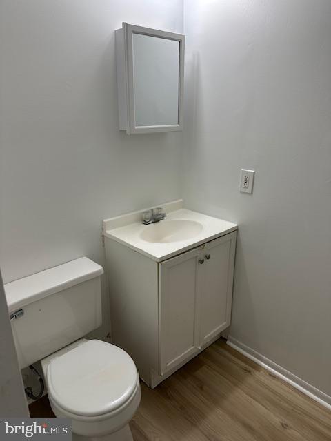 2411 Potterfield Road Windsor Mill, MD 21244 - Photo 23 of 28 a bathroom with a toilet sink and mirror