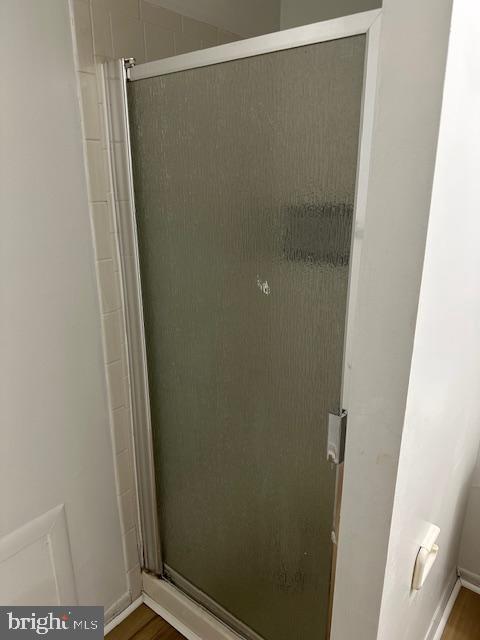 2411 Potterfield Road Windsor Mill, MD 21244 - Photo 25 of 28 a bathroom with a glass shower door
