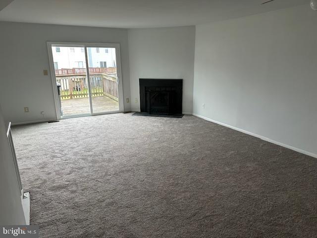 2411 Potterfield Road Windsor Mill, MD 21244 - Photo 4 of 28 an empty room with a fireplace and windows