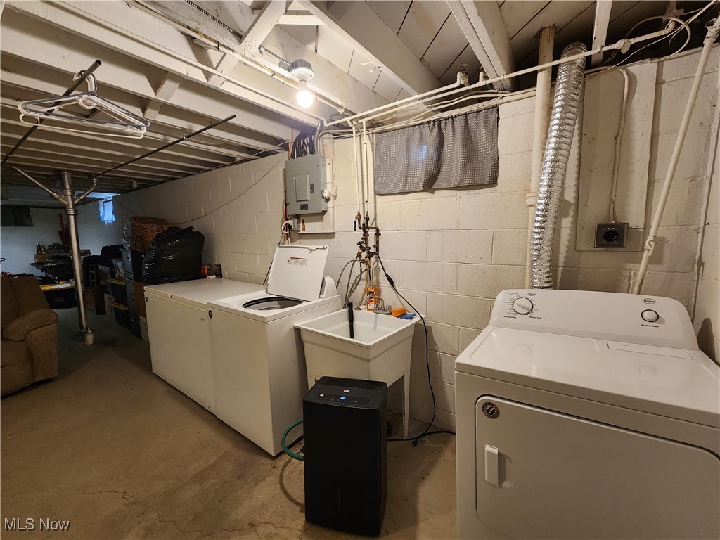 667 Sterling Road Wickliffe, OH 44092 - Photo 24 of 41 Laundry room with electric panel, laundry area, and washing machine and dryer