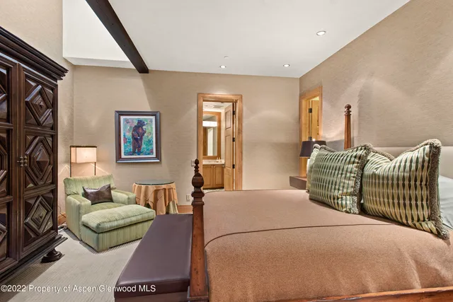 a spacious bathroom with a tub sink and mirror