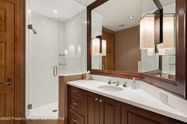 a bedroom with a bed window and couch