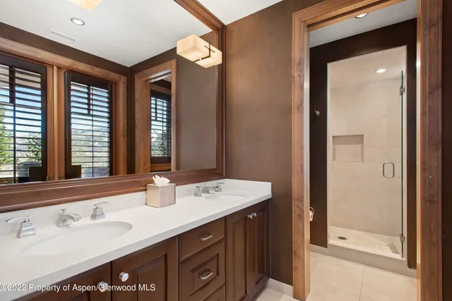 a front view of a house with yard and trees