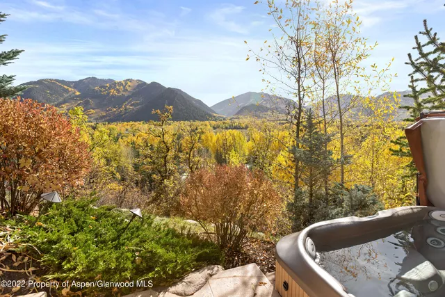 a living room with furniture a clock and wall