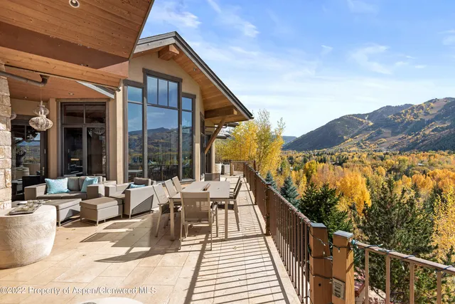 a view of balcony with furniture