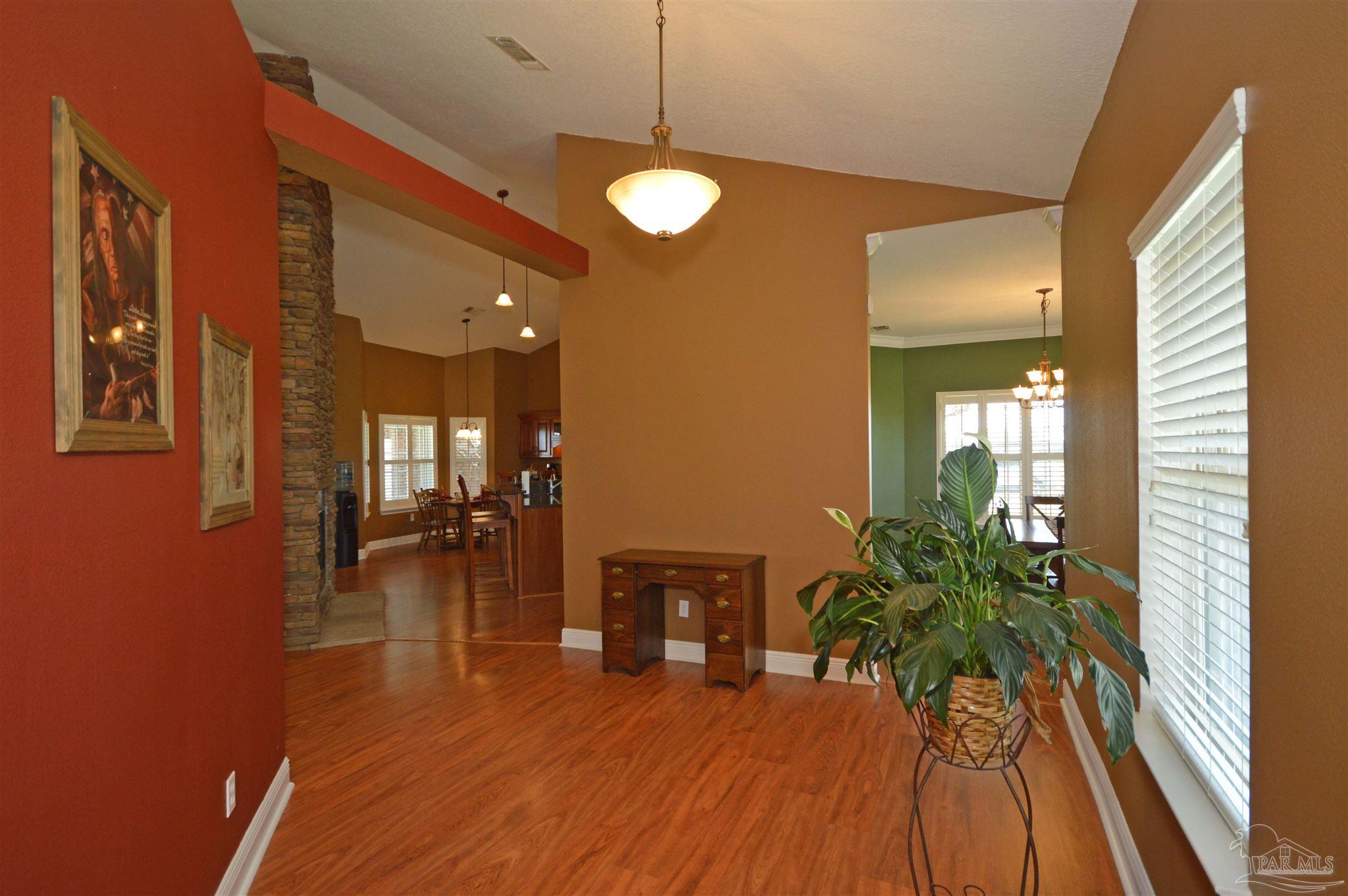 3478 Pine Level Church Road Jay, FL 32565 - Photo 8 of 50 a view of a room with wooden floor and potted plant