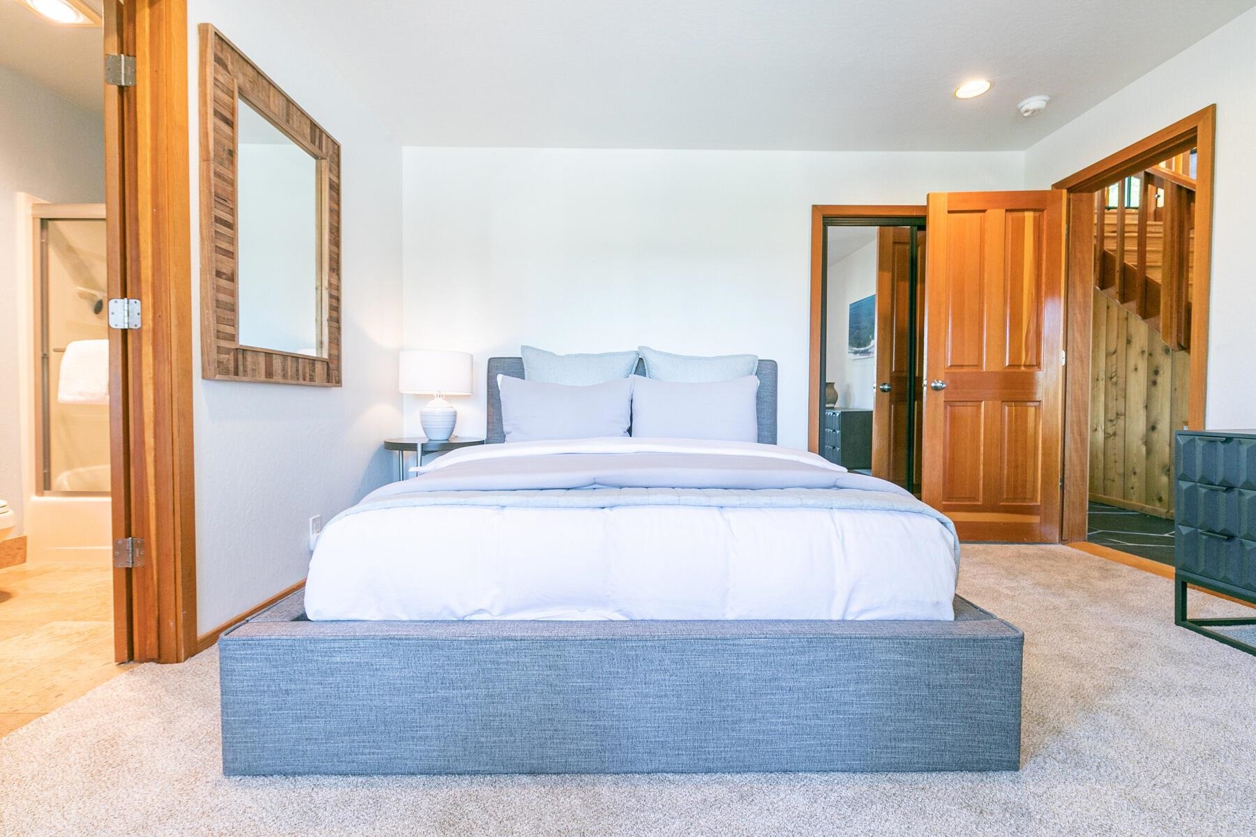 397 Skidder Trail Truckee, CA 96161 - Photo 12 of 21 a bedroom with a large bed and a large window