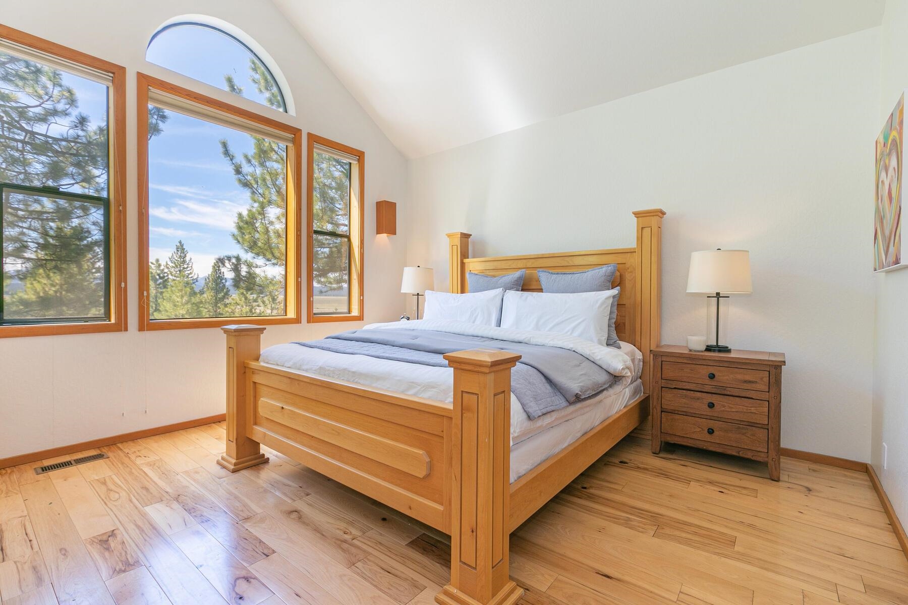 397 Skidder Trail Truckee, CA 96161 - Photo 8 of 21 a bedroom with a bed a dresser and a large window