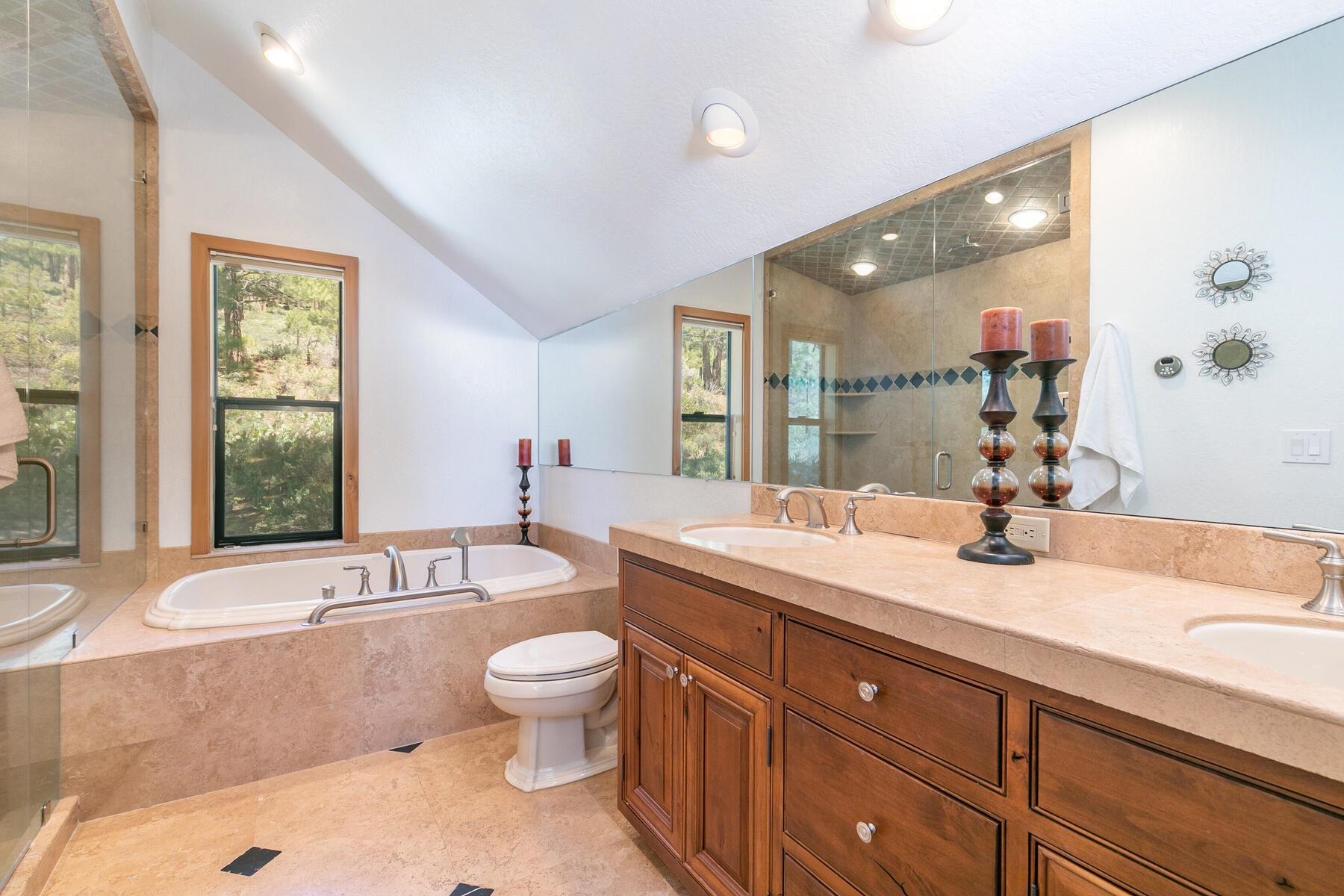 397 Skidder Trail Truckee, CA 96161 - Photo 9 of 21 a spacious bathroom with a granite countertop tub sink and mirror