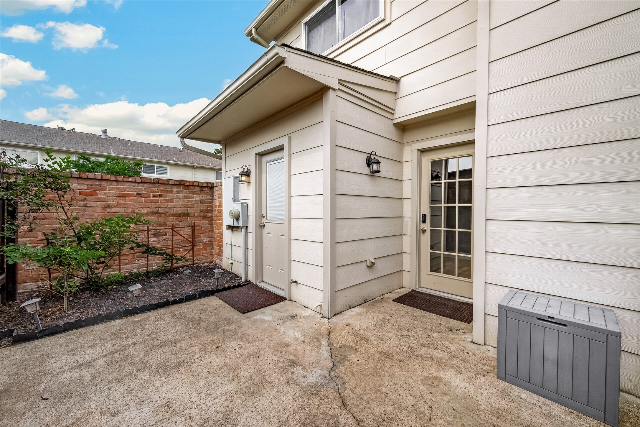 14737 Perthshire Road Houston, TX 77079 - Photo 21 of 22 Seamlessly connect indoor and outdoor living with this inviting patio, perfect for family gatherings and grilling.