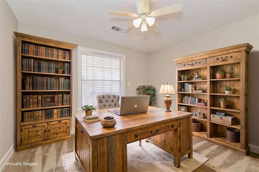 106 Emerald Lane Hampton, GA 30228 - Photo 4 of 19 a view of a workspace with furniture
