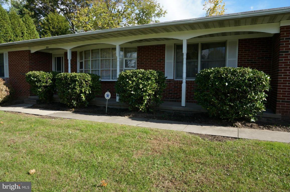 8611 McDaniel Road Baltimore, MD 21237 - Photo 2 of 21 a front view of a house with garden