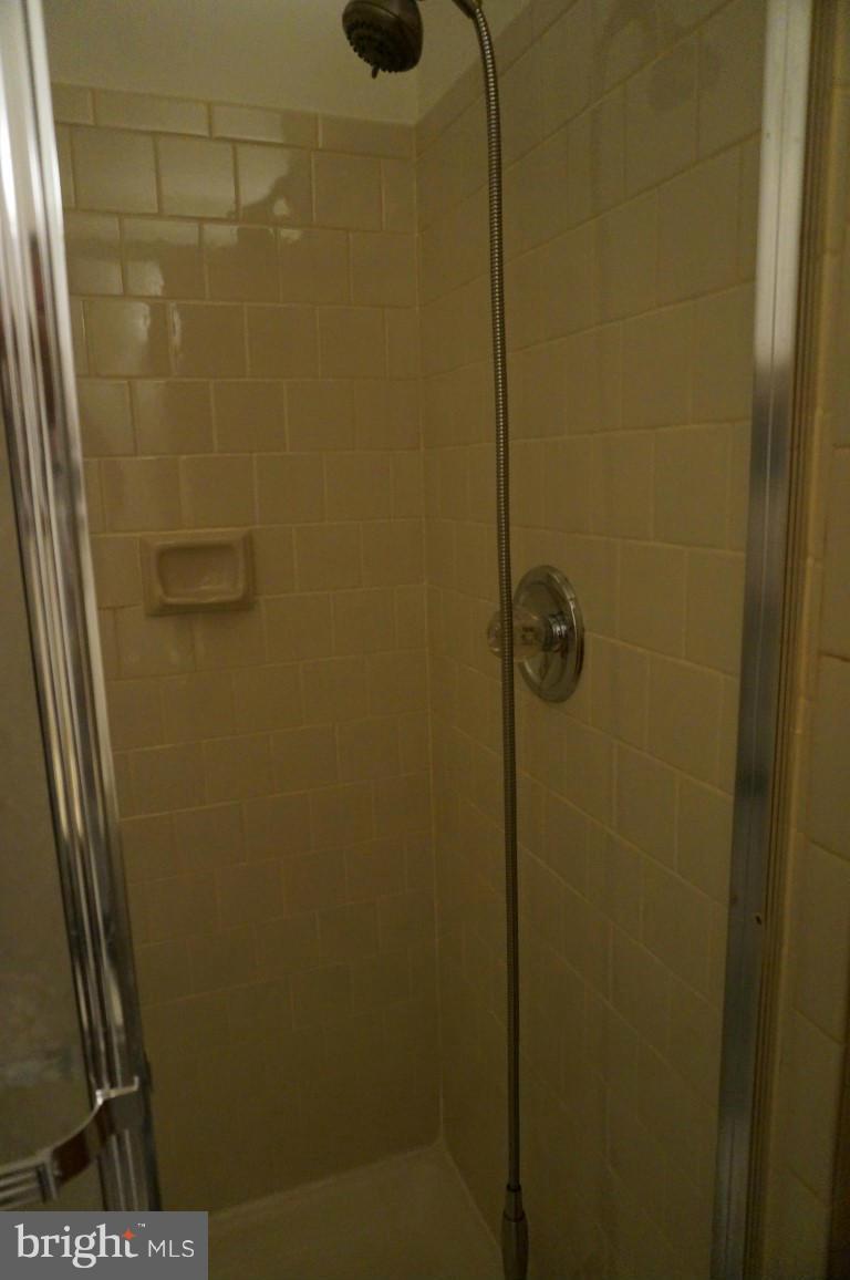 8611 McDaniel Road Baltimore, MD 21237 - Photo 11 of 21 a bathroom with a shower