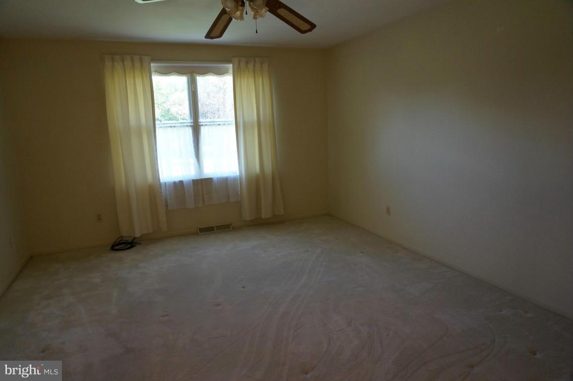 8611 McDaniel Road Baltimore, MD 21237 - Photo 15 of 21 an empty room with a empty space and windows