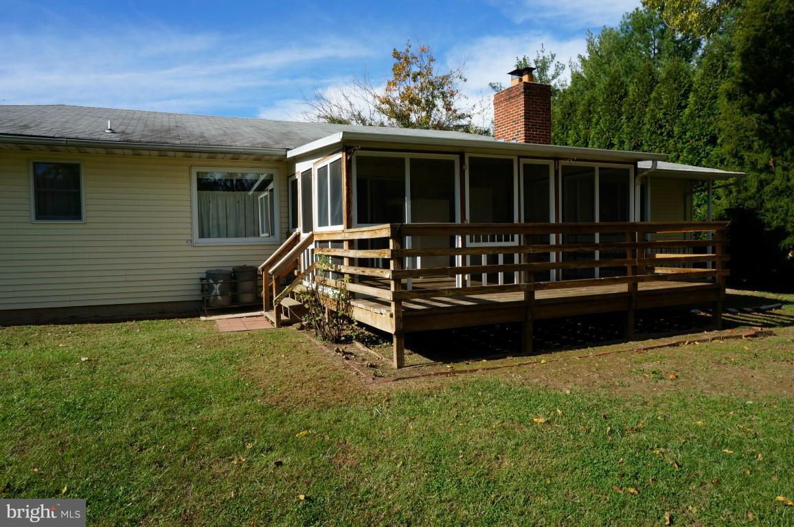 8611 McDaniel Road Baltimore, MD 21237 - Photo 20 of 21 a view of a house with a yard