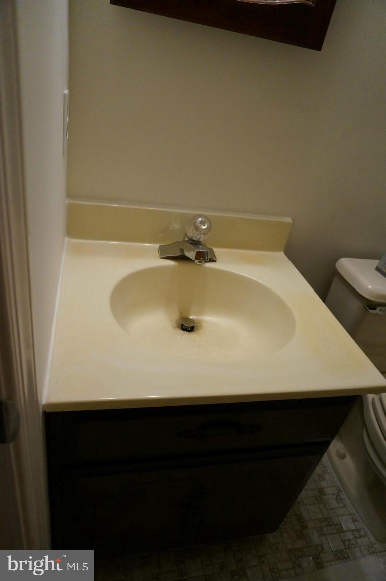 8611 McDaniel Road Baltimore, MD 21237 - Photo 10 of 21 a bathroom with a sink