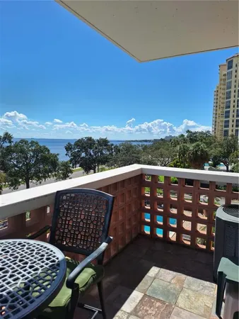 a view of balcony with furniture