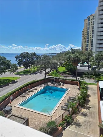 a view of a swimming pool and lake view
