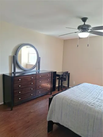 a bedroom with a bed and a dresser