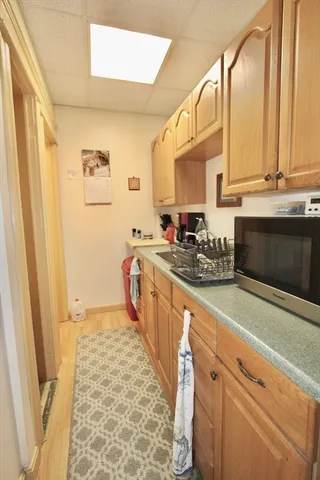 a kitchen with stainless steel appliances a sink and a refrigerator