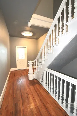 a view of entryway with wooden floor
