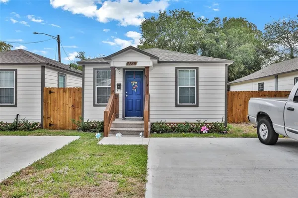 a front view of a house with garage