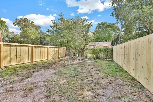 a view of a backyard with tree s