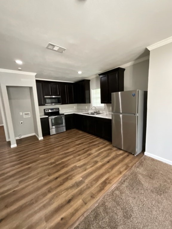 4126 Sayers Street Houston, TX 77026 - Photo 6 of 13 a view of kitchen with stainless steel appliances wooden floor and living room