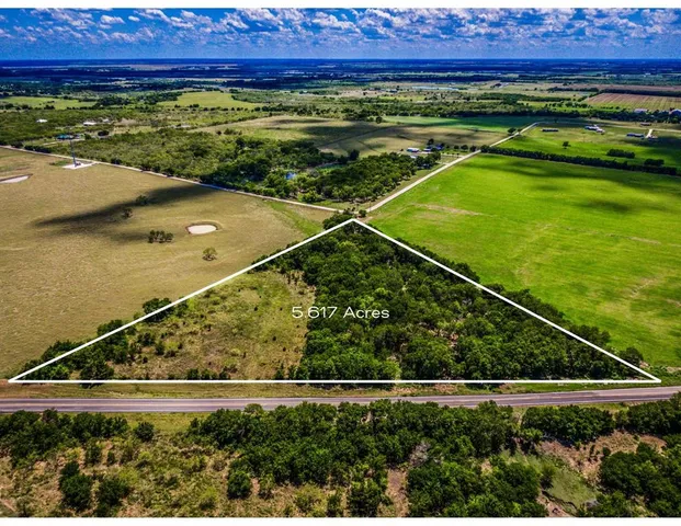a view of a back yard of a house with a swimming pool