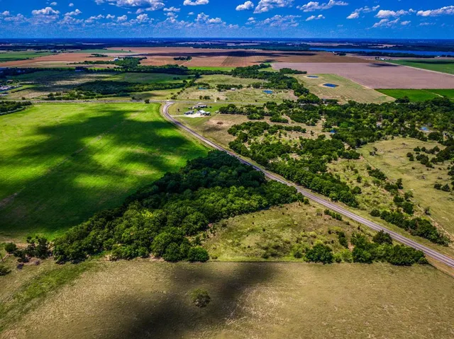 a view of a yard with an ocean