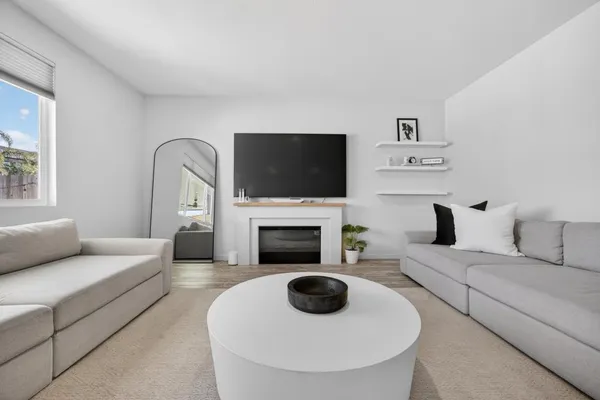 a bedroom with furniture and a lamp