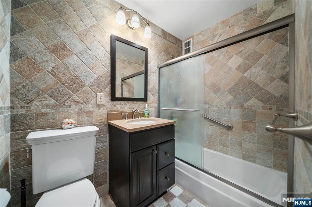 2200 North Central Road, Unit 6H Fort Lee, NJ 07024 - Photo 18 of 18 a bathroom with a sink toilet and shower