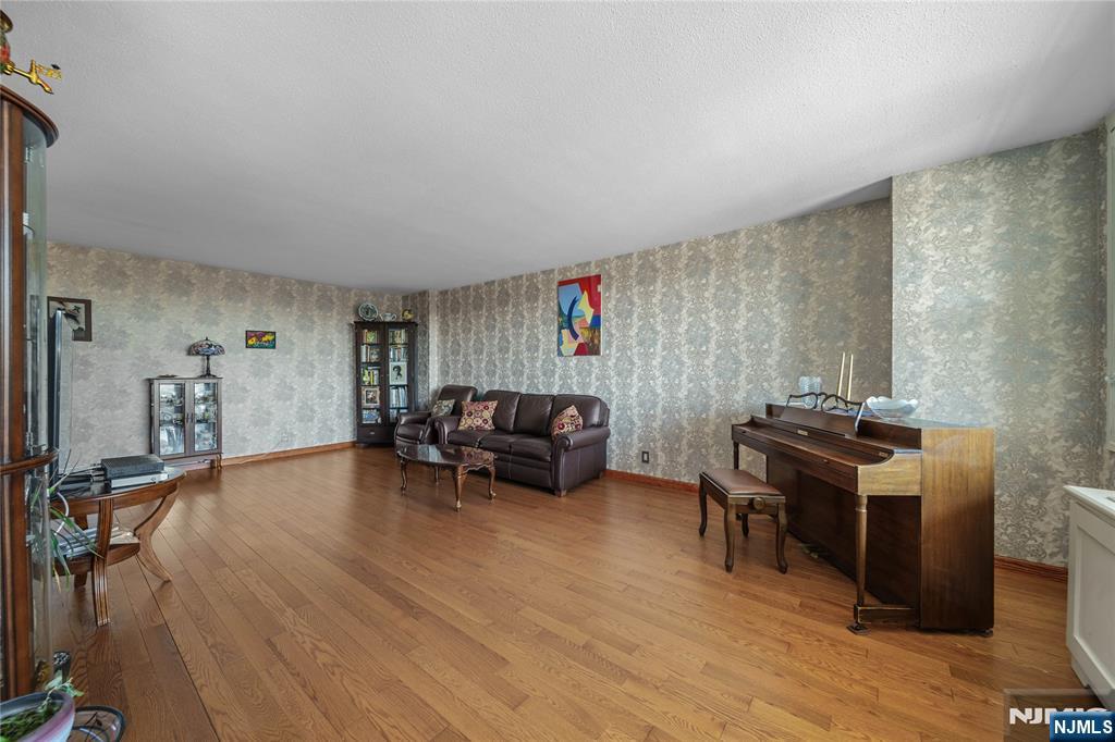 2200 North Central Road, Unit 6H Fort Lee, NJ 07024 - Photo 4 of 18 a view of a workspace with furniture and a kitchen