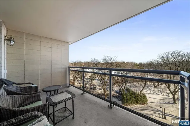 a view of a floor to ceiling window and outdoor seating