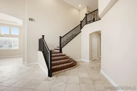 a view of entryway and hall with a window