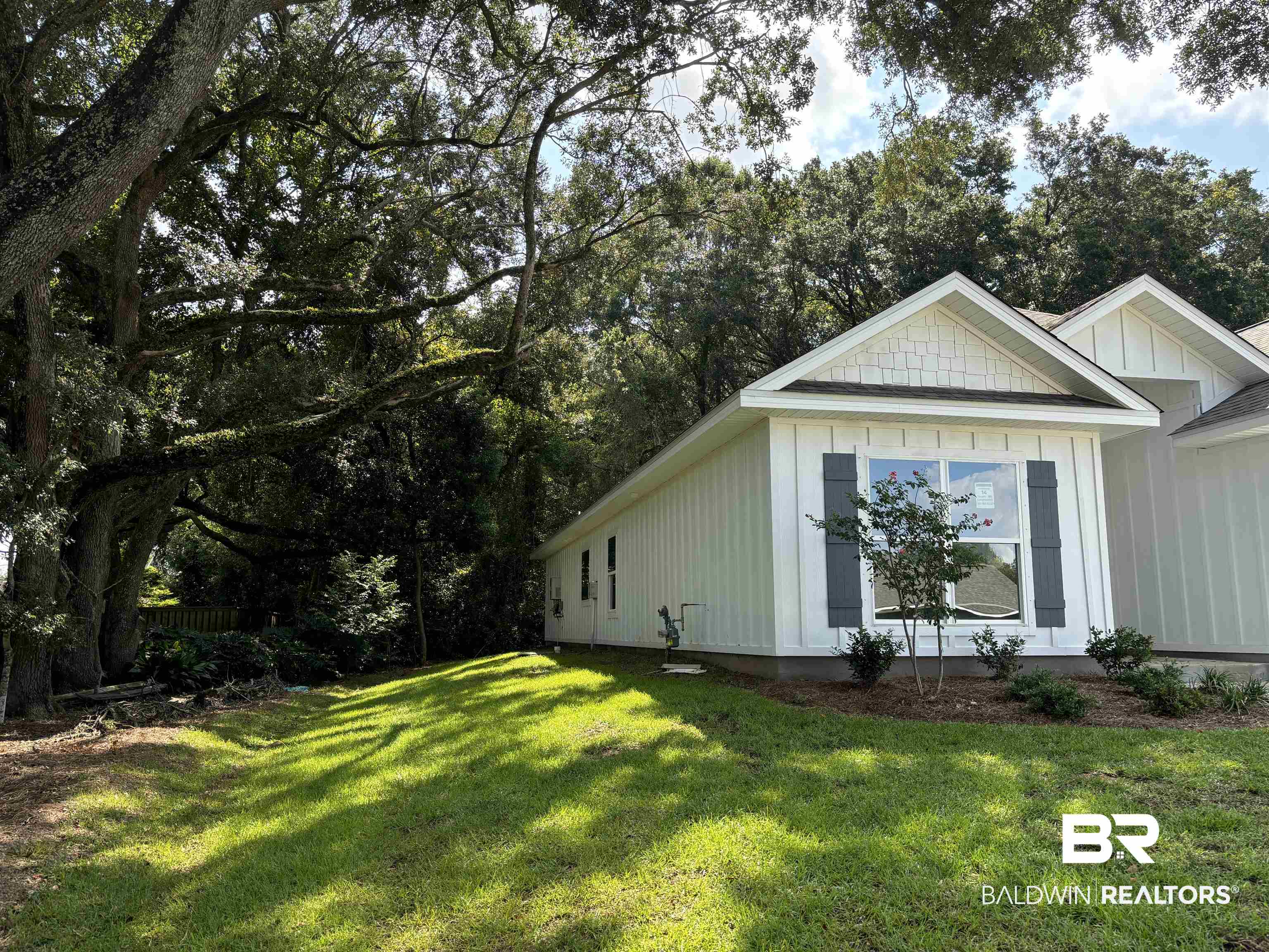 370 Barndling Street Fairhope, AL 36532 - Photo 3 of 30 View of side of property featuring a lawn