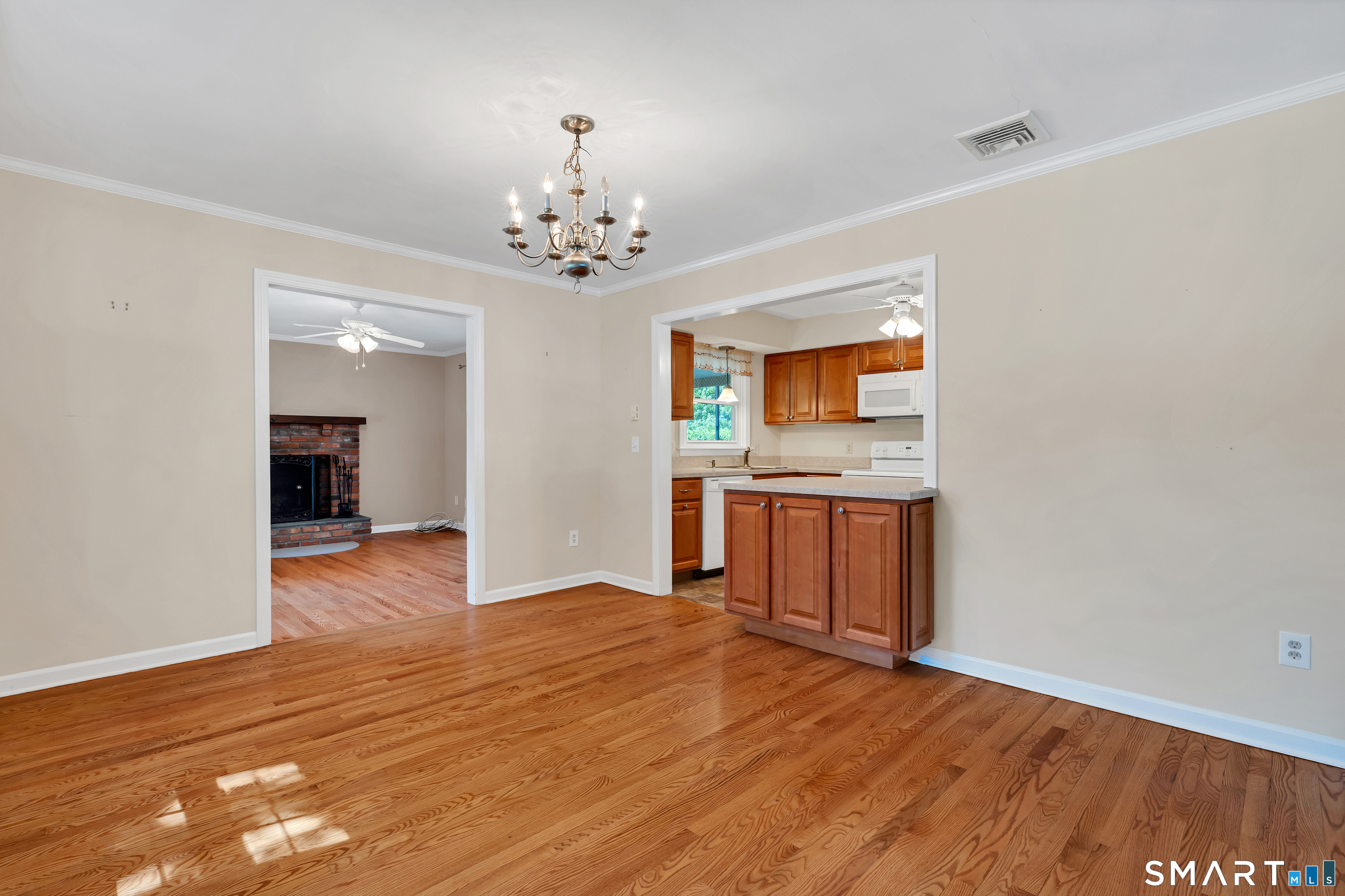 28 Downing Way, Unit 28 Madison, CT 06443 - Photo 5 of 30 Dining room is off the living room and open to kitchen