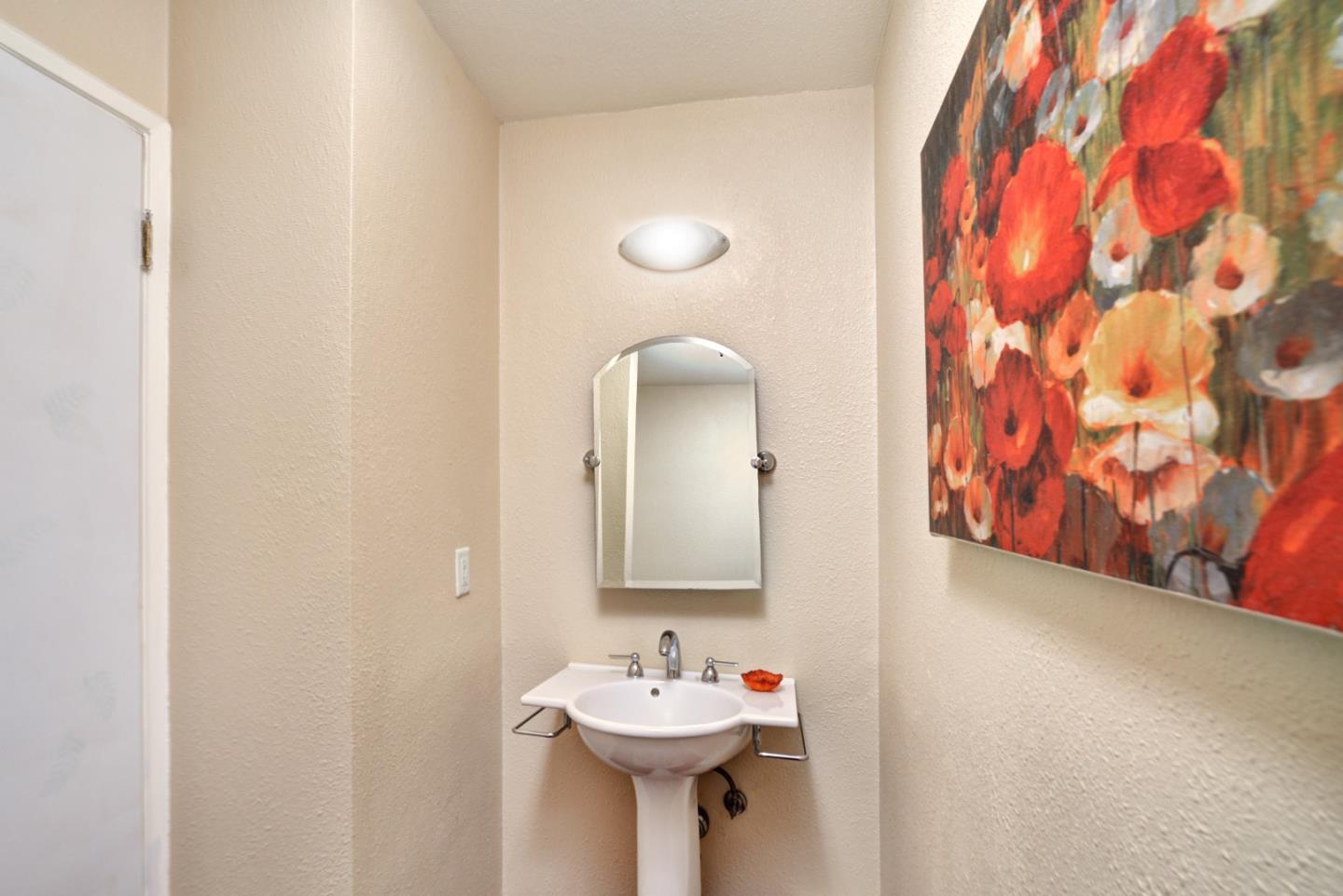 3850 Rio Road, Unit 40 Carmel, CA 93923 - Photo 14 of 28 a bathroom with a sink and a mirror