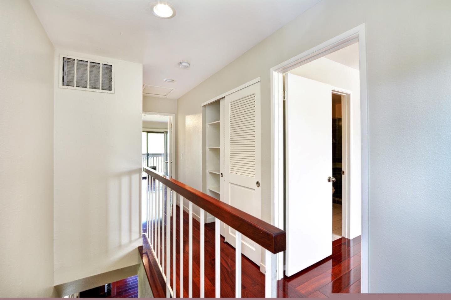 3850 Rio Road, Unit 40 Carmel, CA 93923 - Photo 15 of 28 a view of a hallway with windows and stairs