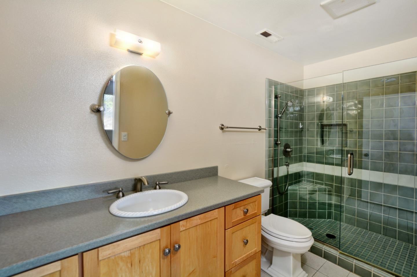 3850 Rio Road, Unit 40 Carmel, CA 93923 - Photo 17 of 28 a bathroom with a sink a toilet and shower