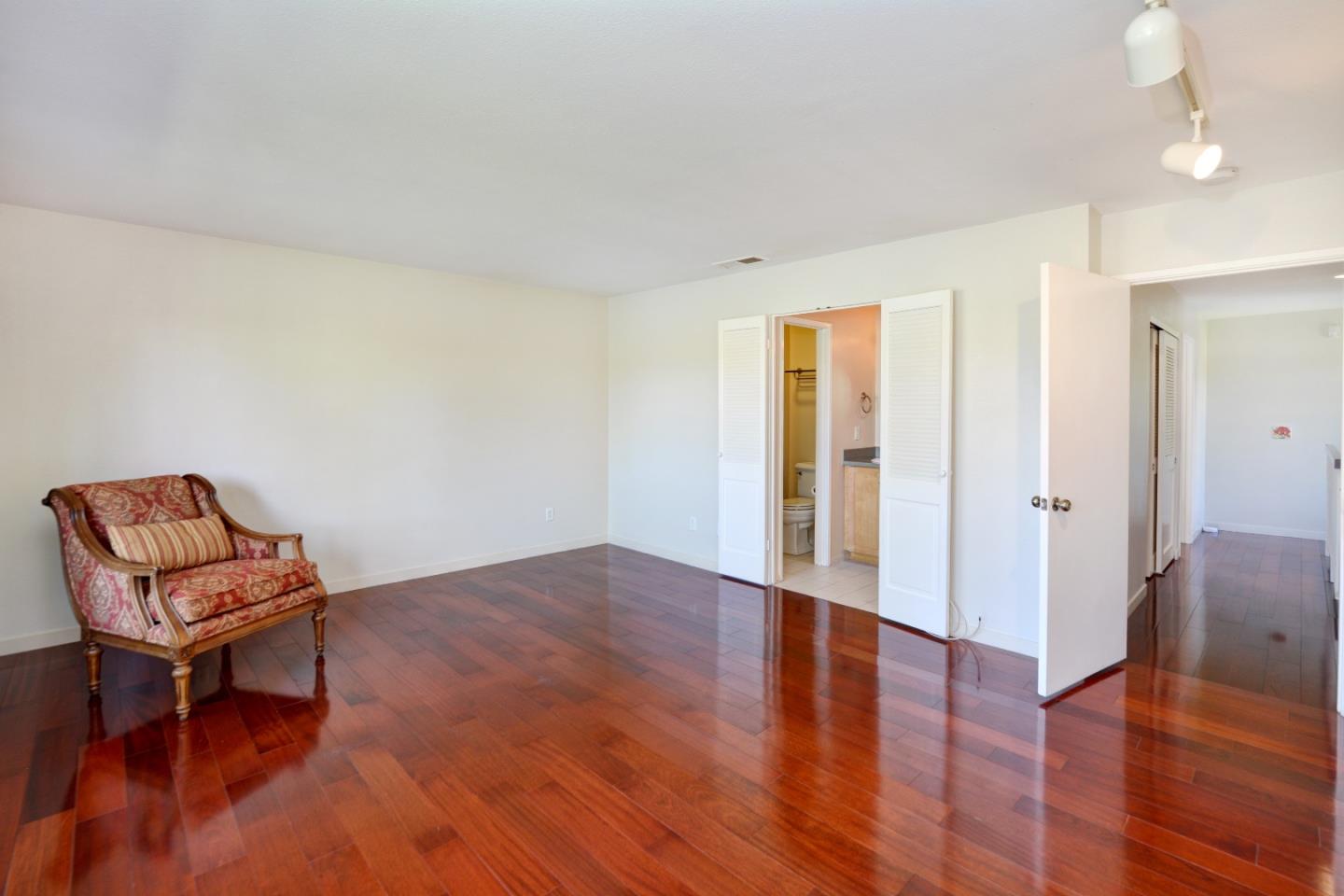 3850 Rio Road, Unit 40 Carmel, CA 93923 - Photo 18 of 28 a view of a livingroom with lounge chair and a chair